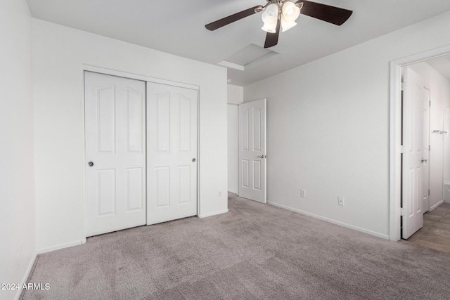 unfurnished bedroom with ceiling fan, a closet, and light colored carpet