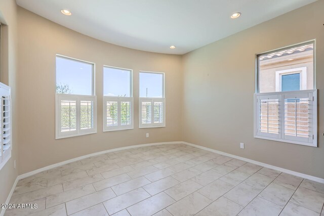 spare room with plenty of natural light