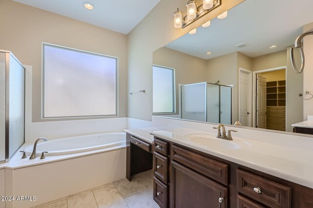 bathroom featuring plus walk in shower and vanity