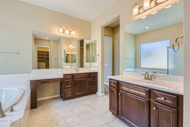 bathroom featuring tile patterned floors, vanity, and a bathtub