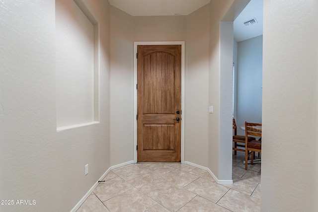 view of tiled foyer entrance