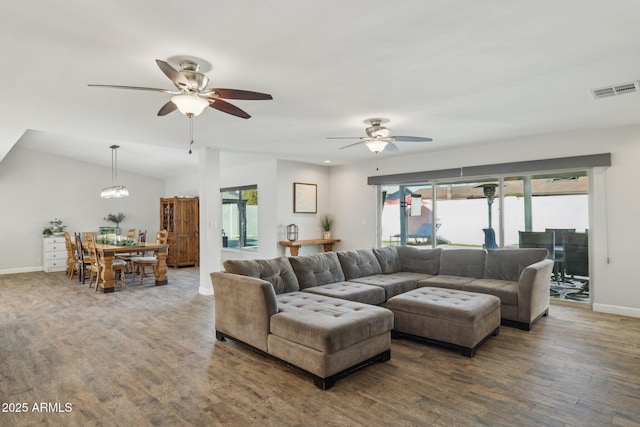 living room featuring ceiling fan, lofted ceiling, and hardwood / wood-style floors