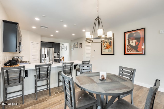 3699 E Sweetclover Ln, San Tan Valley, AZ 85140 - dining area featuring recessed lighting, baseboards, light wood-style floors, and visible vents