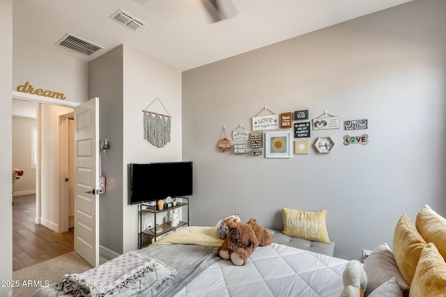 3699 E Sweetclover Ln, San Tan Valley, AZ 85140 - bedroom with baseboards, visible vents, and wood finished floors