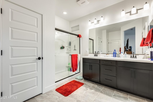 3699 E Sweetclover Ln, San Tan Valley, AZ 85140 - full bathroom featuring double vanity, visible vents, a sink, and a shower stall