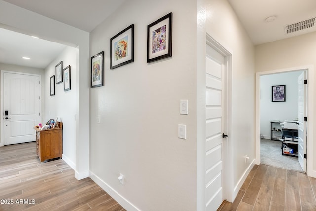 3699 E Sweetclover Ln, San Tan Valley, AZ 85140 - hallway featuring baseboards, light wood finished floors, and visible vents