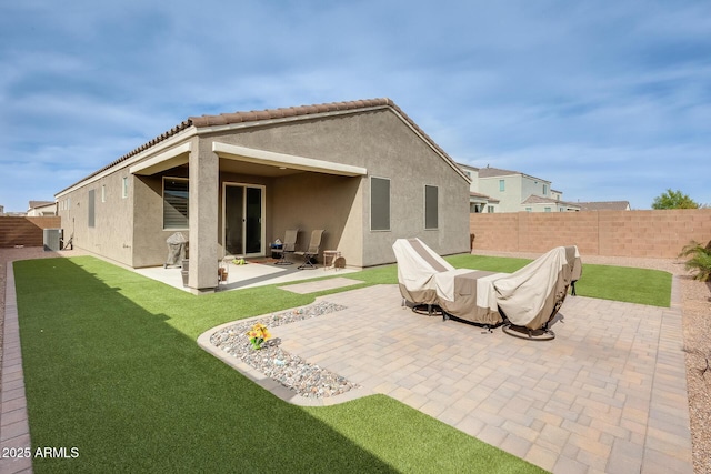 3699 E Sweetclover Ln, San Tan Valley, AZ 85140 - back of property featuring a fenced backyard, stucco siding, a yard, and a patio area
