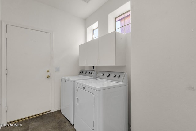 laundry room with cabinets and washing machine and dryer