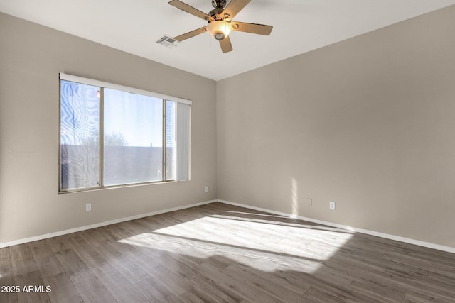 unfurnished room with hardwood / wood-style flooring and ceiling fan