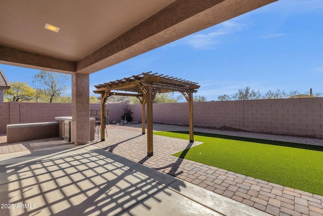 view of patio featuring a pergola and an outdoor bar