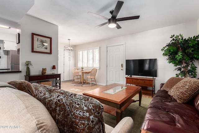 living room with hardwood / wood-style floors and ceiling fan