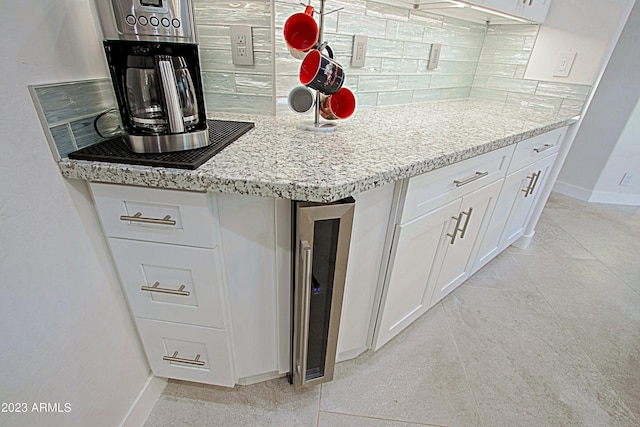 32472 N 68th Pl, Scottsdale, AZ 85266 - kitchen with backsplash, baseboards, wine cooler, and white cabinets