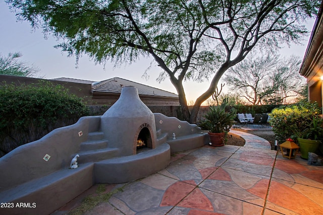 32472 N 68th Pl, Scottsdale, AZ 85266 - view of patio / terrace with a fenced backyard and a warm lit fireplace