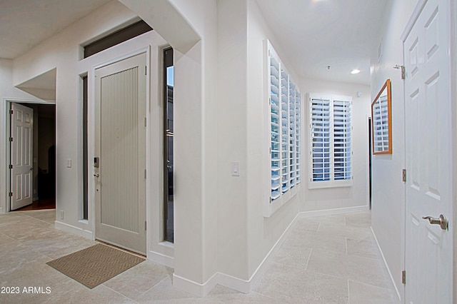 32472 N 68th Pl, Scottsdale, AZ 85266 - hallway with baseboards, arched walkways, light tile patterned floors, and recessed lighting