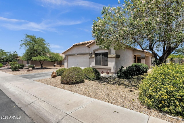 4332 E Cassia Ln, Gilbert, AZ 85298 - view of front facade with stucco siding, an attached garage, a tiled roof, and concrete driveway