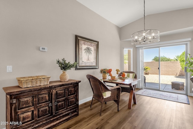 4332 E Cassia Ln, Gilbert, AZ 85298 - dining area with a chandelier, wood finished floors, lofted ceiling, and baseboards