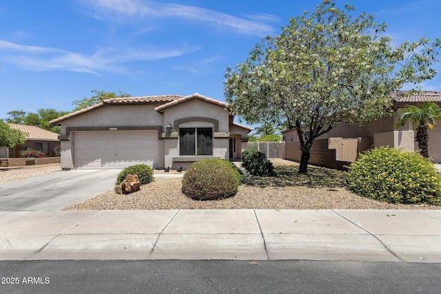 4332 E Cassia Ln, Gilbert, AZ 85298 - mediterranean / spanish home featuring a garage, stucco siding, concrete driveway, and a tile roof