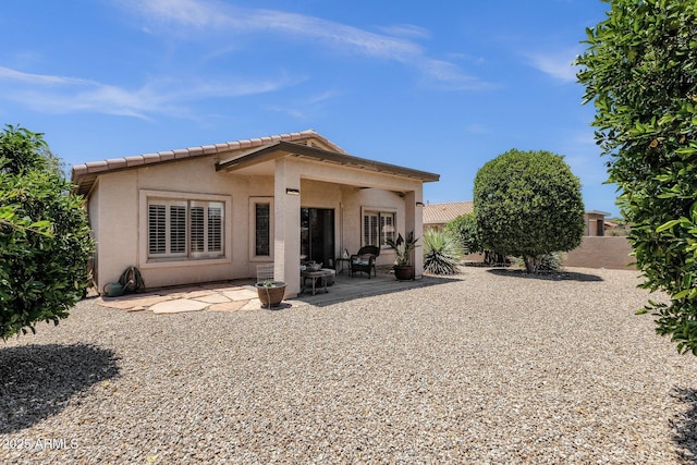 4332 E Cassia Ln, Gilbert, AZ 85298 - back of property with stucco siding, a patio area, and a tiled roof