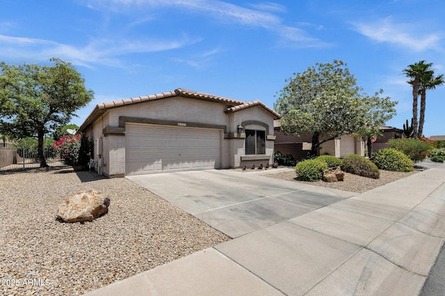 4332 E Cassia Ln, Gilbert, AZ 85298 - mediterranean / spanish home with an attached garage, concrete driveway, stucco siding, and a tile roof