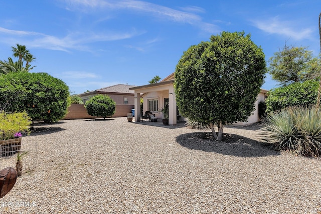 4332 E Cassia Ln, Gilbert, AZ 85298 - back of property with stucco siding and a patio