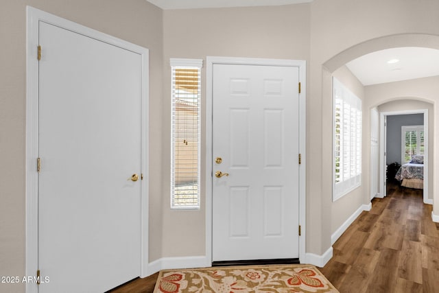 4332 E Cassia Ln, Gilbert, AZ 85298 - entryway with arched walkways, wood finished floors, and baseboards