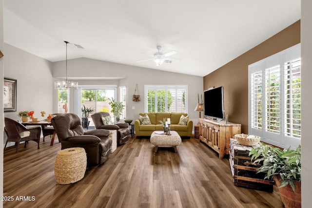 4332 E Cassia Ln, Gilbert, AZ 85298 - living area with lofted ceiling, dark wood-style flooring, a chandelier, and a ceiling fan