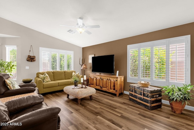 4332 E Cassia Ln, Gilbert, AZ 85298 - living area with lofted ceiling, wood finished floors, a ceiling fan, and baseboards