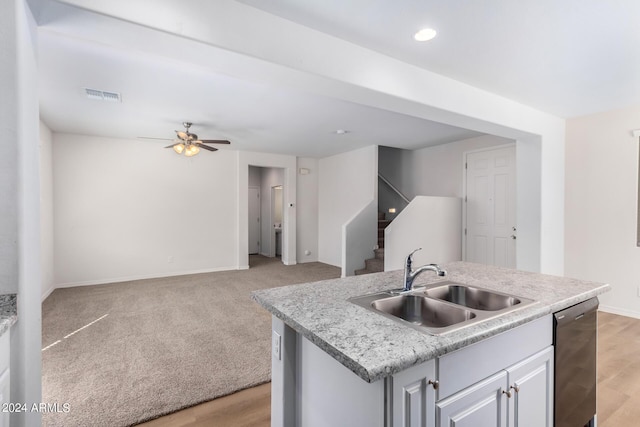 935 E Agua Fria Ln, Avondale, AZ 85323 - kitchen with dishwashing machine, a sink, open floor plan, baseboards, and recessed lighting