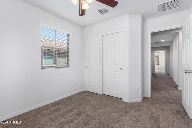 935 E Agua Fria Ln, Avondale, AZ 85323 - unfurnished bedroom featuring carpet floors, a closet, baseboards, and a ceiling fan