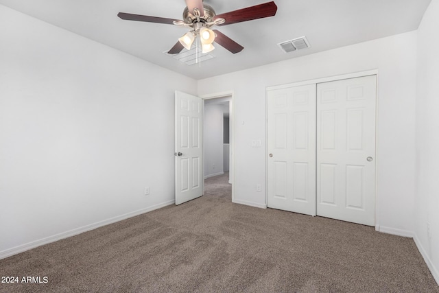 935 E Agua Fria Ln, Avondale, AZ 85323 - unfurnished bedroom with carpet, baseboards, a closet, and a ceiling fan