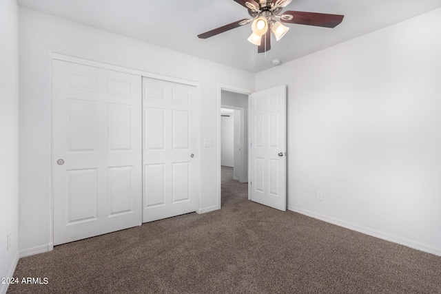 935 E Agua Fria Ln, Avondale, AZ 85323 - unfurnished bedroom featuring carpet flooring, a closet, baseboards, and a ceiling fan