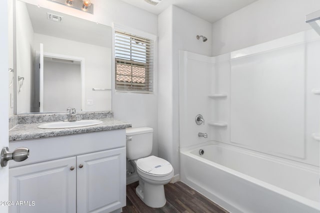935 E Agua Fria Ln, Avondale, AZ 85323 - full bath with toilet, vanity, wood finished floors, and tub / shower combination
