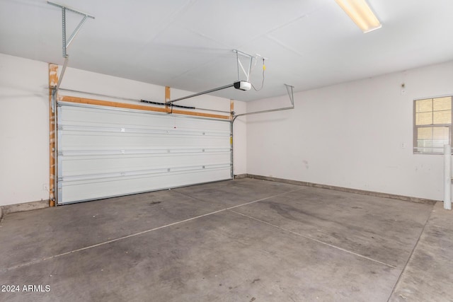 935 E Agua Fria Ln, Avondale, AZ 85323 - garage featuring a garage door opener and baseboards