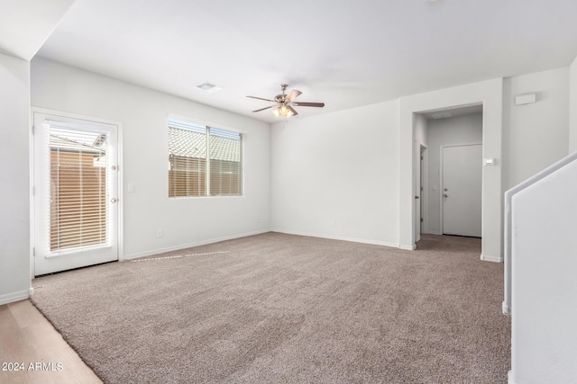 935 E Agua Fria Ln, Avondale, AZ 85323 - spare room featuring ceiling fan, baseboards, and light colored carpet