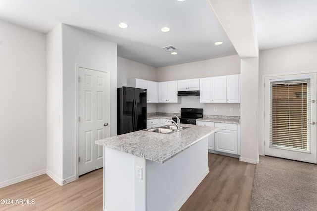 935 E Agua Fria Ln, Avondale, AZ 85323 - kitchen featuring black appliances, a sink, white cabinetry, light wood-style flooring, and under cabinet range hood