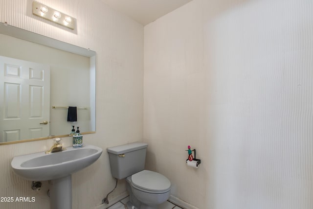 bathroom with sink and toilet