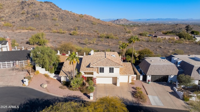 drone / aerial view featuring a mountain view