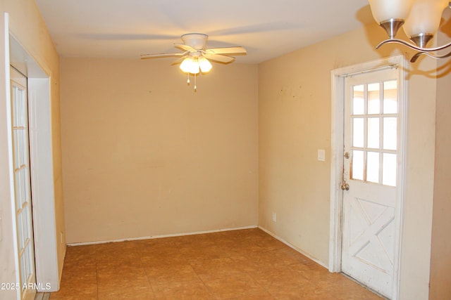 unfurnished room featuring a ceiling fan