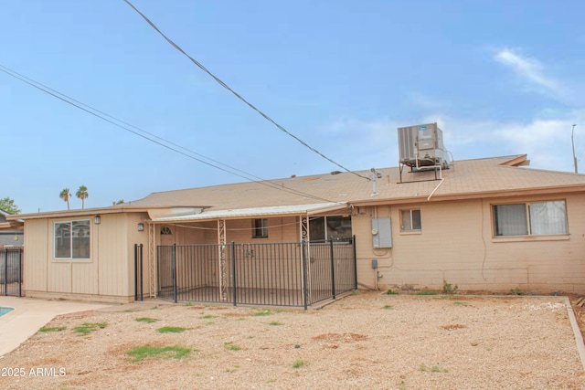 back of property with a patio area, fence, and central air condition unit