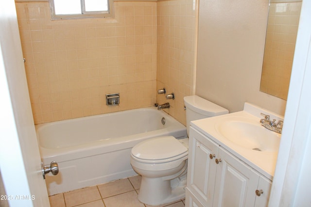 bathroom featuring tile patterned floors, vanity, toilet, and tub / shower combination