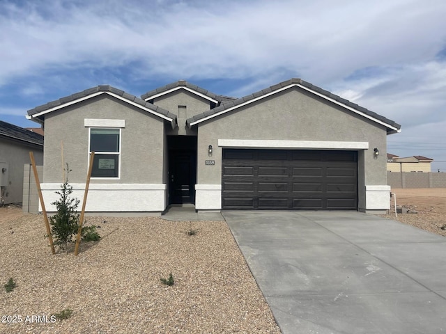 1359 S Vista Ave, Florence, AZ 85132 - single story home featuring stucco siding, an attached garage, and driveway