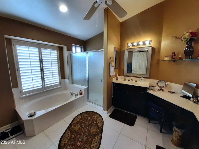full bathroom featuring vaulted ceiling, a ceiling fan, a shower stall, a garden tub, and vanity