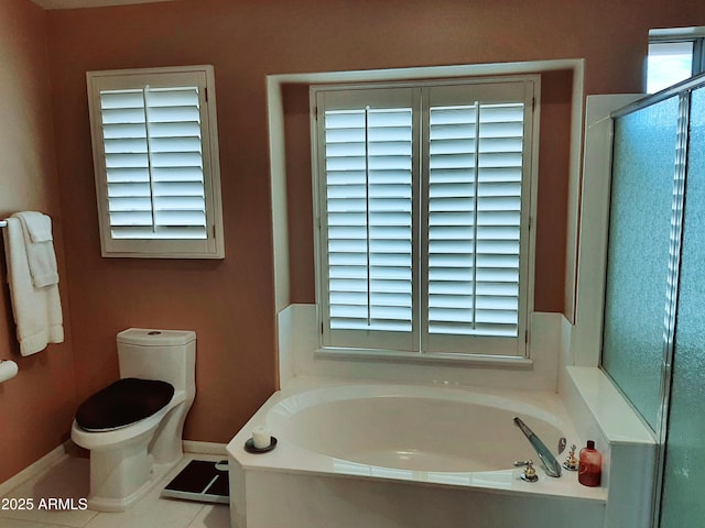 full bath featuring tile patterned flooring, an enclosed shower, toilet, baseboards, and a garden tub