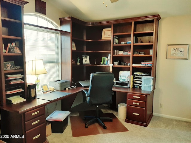 carpeted home office with baseboards