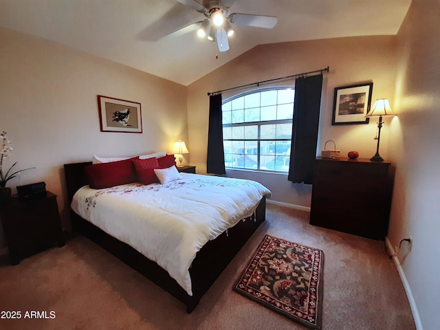 bedroom with light colored carpet, lofted ceiling, a ceiling fan, and baseboards
