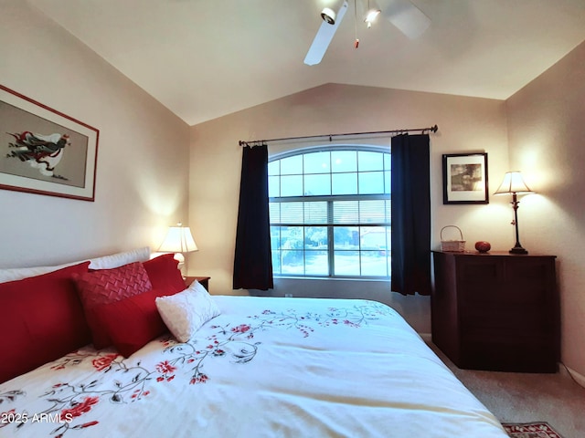 bedroom featuring lofted ceiling, a ceiling fan, and carpet flooring