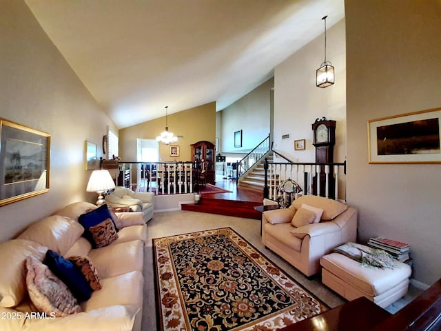 living area featuring a chandelier, stairway, high vaulted ceiling, and carpet