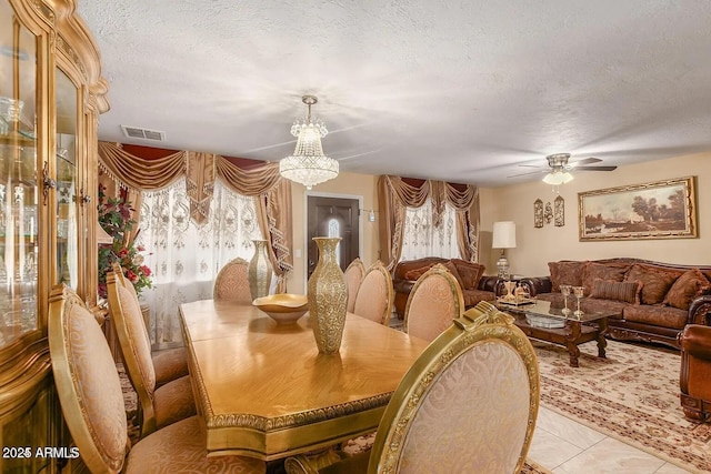 3121 W Greenway Rd, Phoenix, AZ 85053 - dining area with a textured ceiling, ceiling fan with notable chandelier, light tile patterned floors, and visible vents