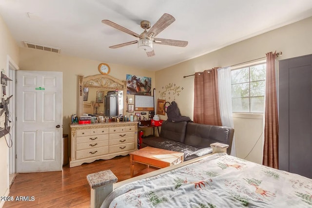 3121 W Greenway Rd, Phoenix, AZ 85053 - bedroom featuring visible vents, ceiling fan, and wood finished floors