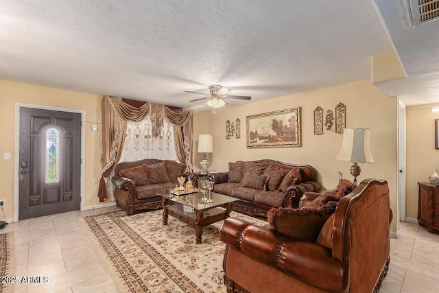 3121 W Greenway Rd, Phoenix, AZ 85053 - living area with visible vents, ceiling fan, baseboards, and a textured ceiling